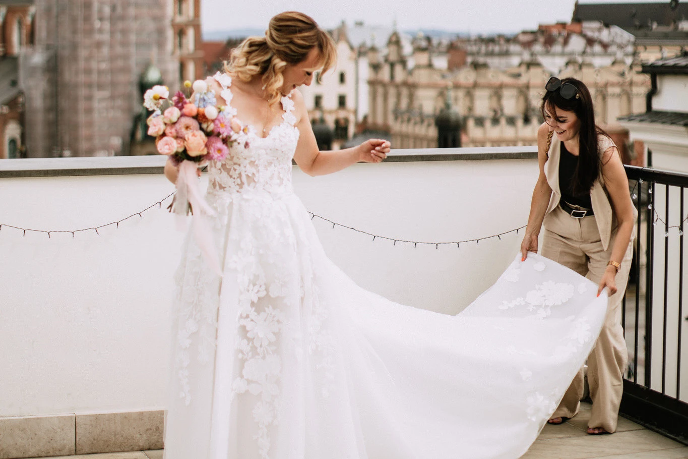 Wedding planner improving the bride's dress